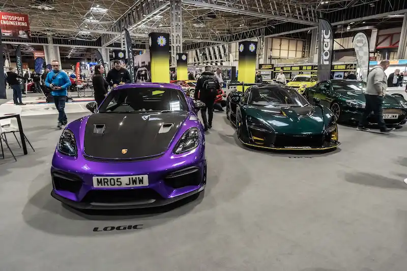 A Porsche 718 Cayman GT4 RS and a McLaren Senna at the Logic stand at NEC Autosport International