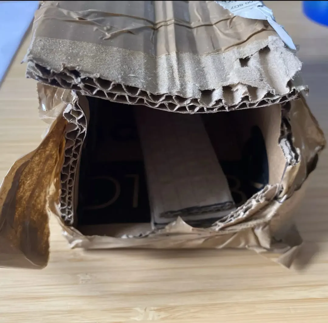 Damaged eBay parcel showing the reality of shipping challenges — why careful packaging became essential